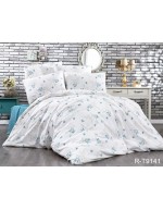 Постель двуспальная белого цвета с листьями на ветвях